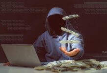 shadowy figure in hoody with laptop tosses cash in air