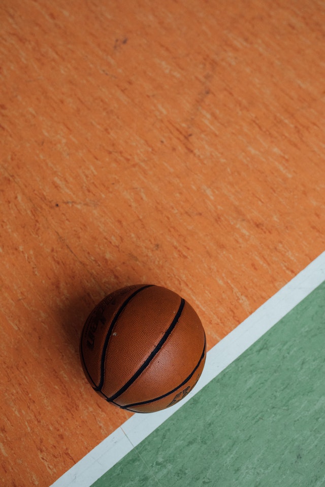 A basketball resting on the court during the NCAA March Madness tournament
