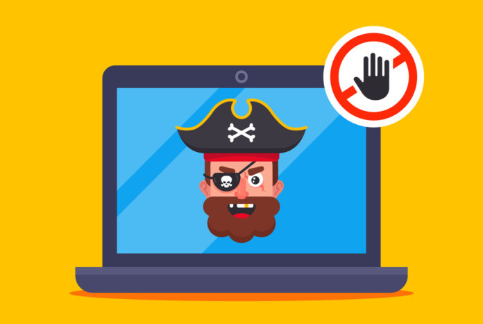 Illustration of a pirate on a laptop screen depicting digital piracy