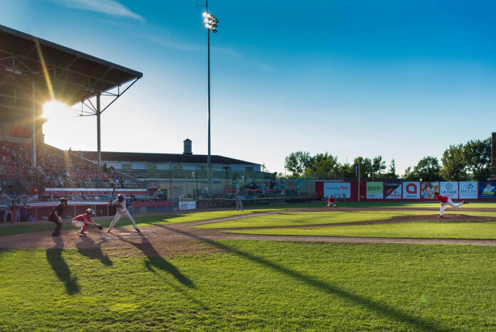 Safely_Watch_MLB2_Unsplash_pierre-etienne-vachon-llvfQvn1kqA-unsplash Players playing Baseball in a Ballpark.