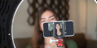 Live Streaming Safety for Kids: What Parents Need to Know Young happy woman live streaming on mobile device
